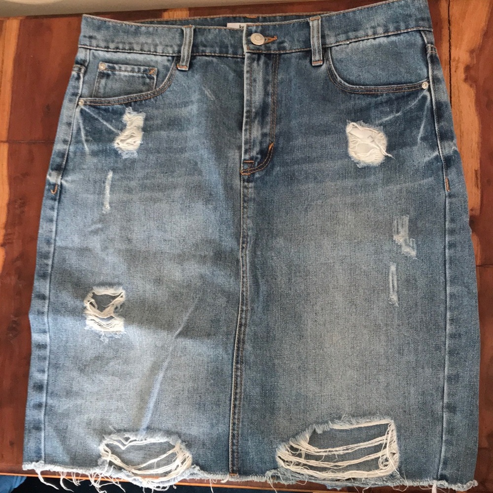 Distressed knee length denim skirt